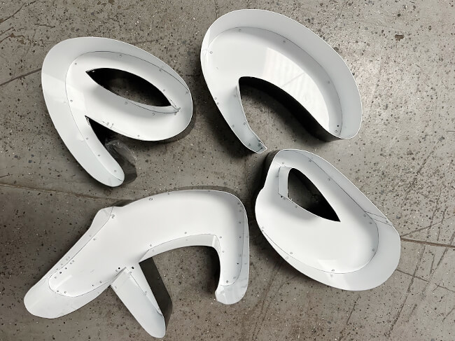 How Varisigns Letter Bending Machine Transforms Your Sign Shop 3 trim cap letters made by Varisigns channel letter bender